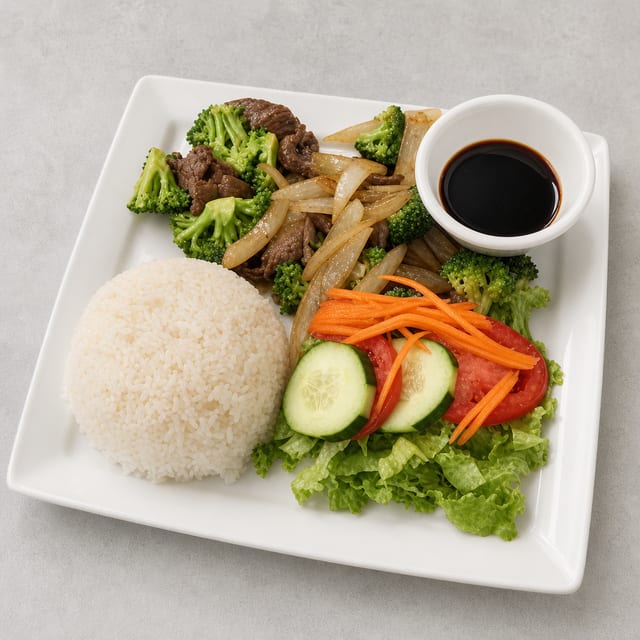C18. StirFry Bo & Broccoli w/ Rice (Com Bo Bong Cai).